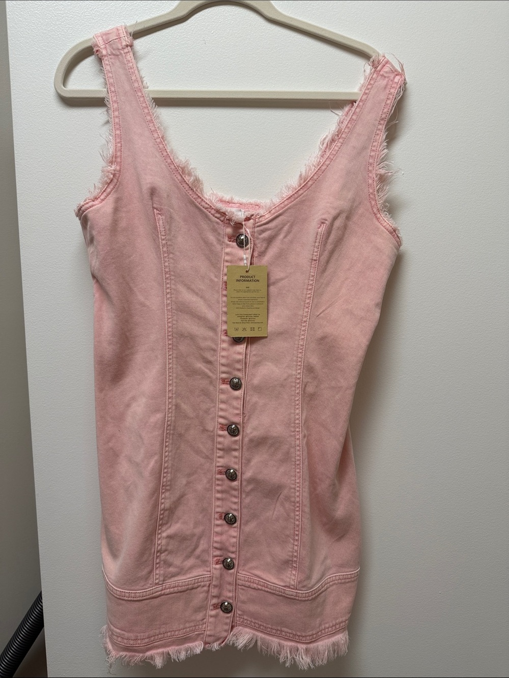 This is the Retro Pink V-Neck Button-Down Sleeveless Denim Mini Dress